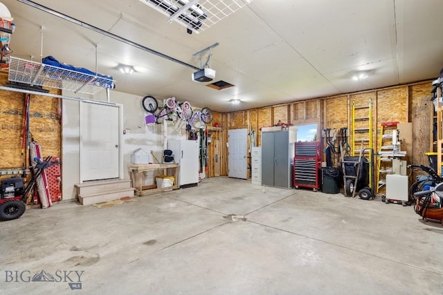 193 Lucille Ln, Bozeman, MT 59718 - garage featuring a garage door opener