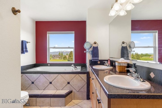 193 Lucille Ln, Bozeman, MT 59718 - full bath with double vanity, a bath, tile patterned floors, and toilet