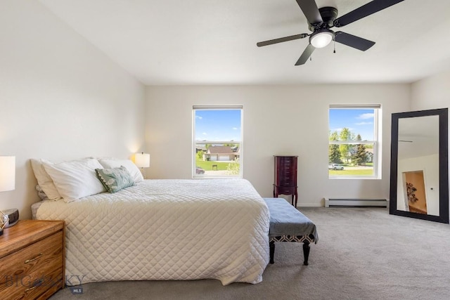 193 Lucille Ln, Bozeman, MT 59718 - bedroom featuring baseboard heating, light colored carpet, ceiling fan, and baseboards