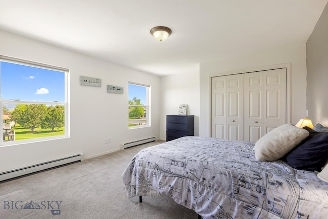193 Lucille Ln, Bozeman, MT 59718 - carpeted bedroom featuring a baseboard radiator and a closet