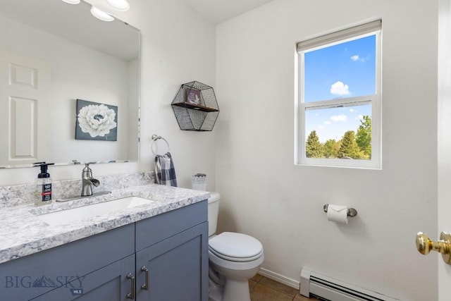 193 Lucille Ln, Bozeman, MT 59718 - bathroom featuring a baseboard radiator, toilet, vanity, and tile patterned floors