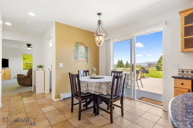 193 Lucille Ln, Bozeman, MT 59718 - dining area with light tile patterned flooring, baseboards, recessed lighting, ceiling fan, and a baseboard radiator