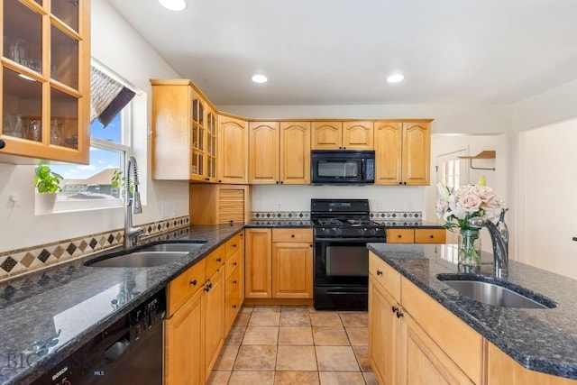 193 Lucille Ln, Bozeman, MT 59718 - kitchen featuring black appliances, a sink, dark stone counters, recessed lighting, and glass insert cabinets