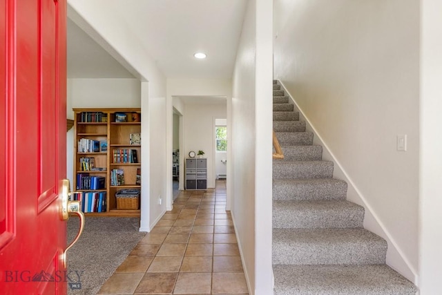 193 Lucille Ln, Bozeman, MT 59718 - carpeted entryway featuring stairway, recessed lighting, baseboards, tile patterned floors, and a baseboard heating unit