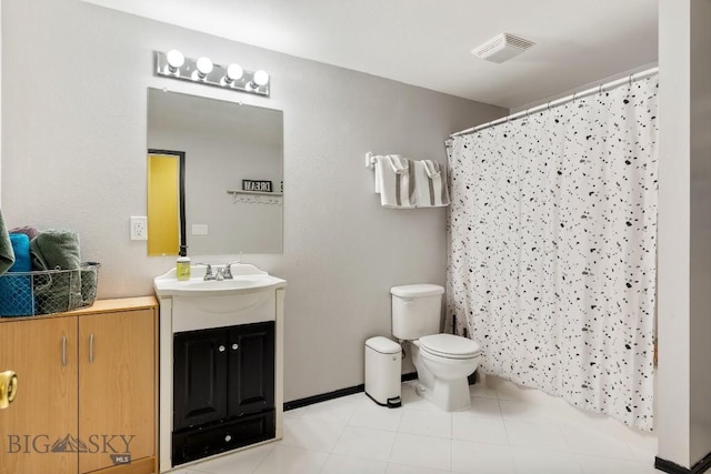 193 Lucille Ln, Bozeman, MT 59718 - full bath with vanity, toilet, curtained shower, and tile patterned floors