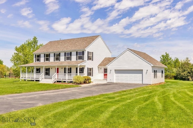 193 Lucille Ln, Bozeman, MT 59718 - colonial-style house featuring a porch, a garage, driveway, and a front yard