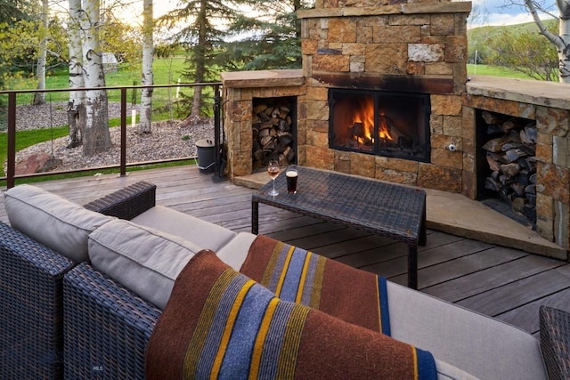 65 Triple Tree Ln, Bozeman, MT 59715 - wooden terrace with an outdoor living space with a fireplace