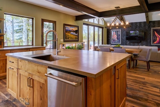 65 Triple Tree Ln, Bozeman, MT 59715 - kitchen with stainless steel dishwasher, a sink, beamed ceiling, open floor plan, and a chandelier