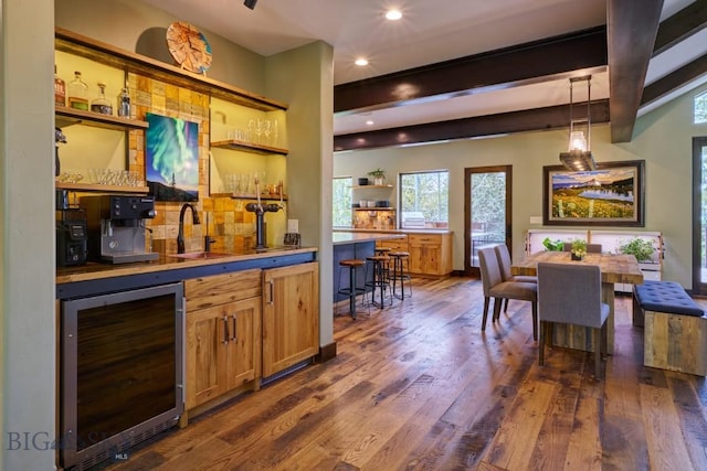 65 Triple Tree Ln, Bozeman, MT 59715 - indoor bar featuring beverage cooler, dark wood-type flooring, beamed ceiling, recessed lighting, and decorative light fixtures