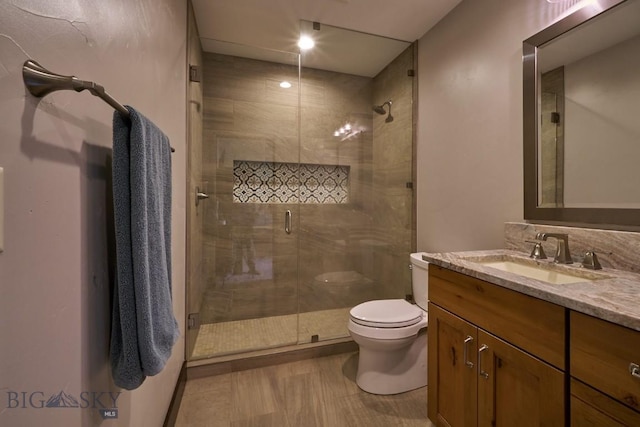 65 Triple Tree Ln, Bozeman, MT 59715 - bathroom with vanity, toilet, and a shower stall