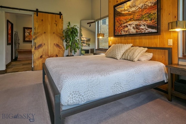 65 Triple Tree Ln, Bozeman, MT 59715 - carpeted bedroom with a barn door