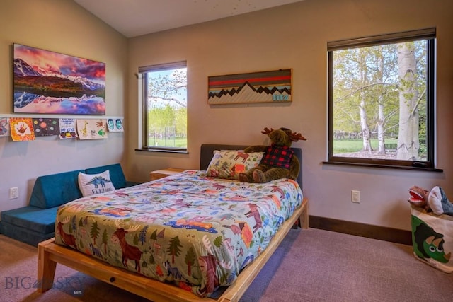 65 Triple Tree Ln, Bozeman, MT 59715 - carpeted bedroom with multiple windows and baseboards