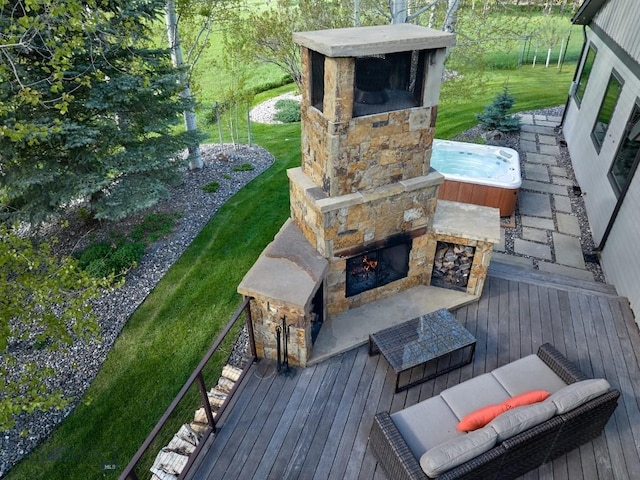 65 Triple Tree Ln, Bozeman, MT 59715 - wooden terrace with an outdoor stone fireplace