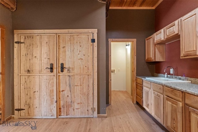 1511 Mt Highway 287, Virginia City, MT 59755 - kitchen with a sink, light wood-style flooring, and light brown cabinets