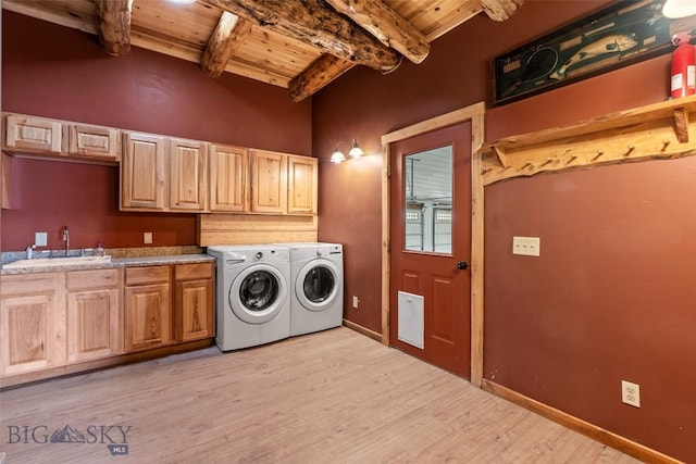 1511 Mt Highway 287, Virginia City, MT 59755 - laundry room with wood ceiling, washer and clothes dryer, cabinet space, and light wood-style floors