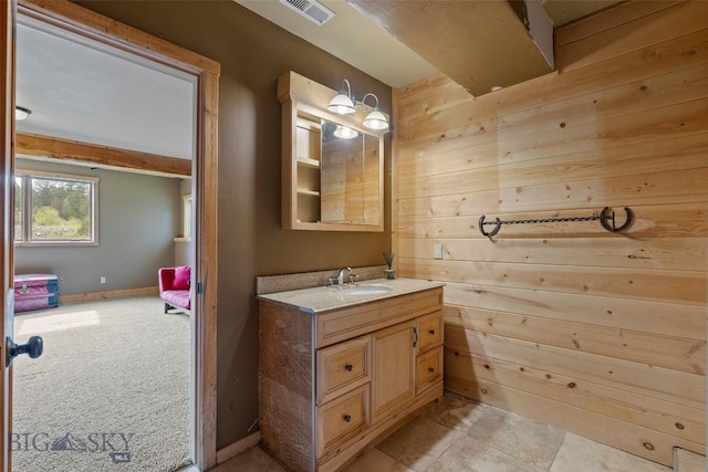 1511 Mt Highway 287, Virginia City, MT 59755 - bathroom with vanity, wood walls, and baseboards