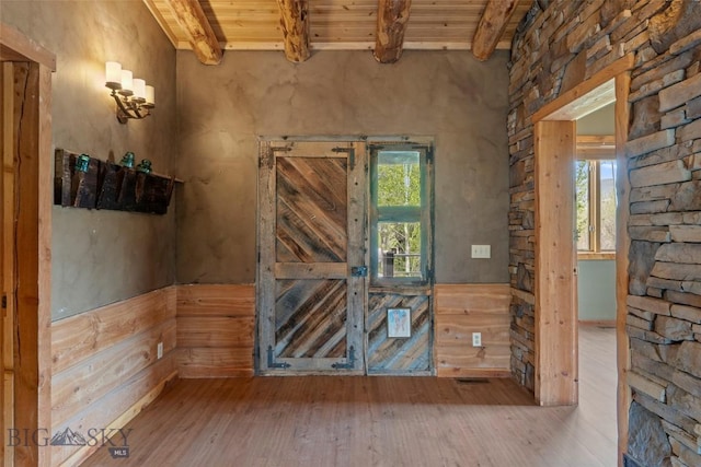 1511 Mt Highway 287, Virginia City, MT 59755 - unfurnished room with wooden ceiling with exposed beams and hardwood / wood-style floors