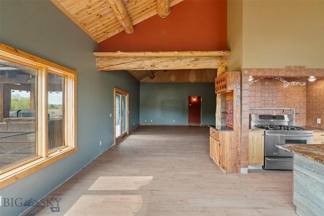 1511 Mt Highway 287, Virginia City, MT 59755 - kitchen with double oven range, wooden ceiling with exposed beams, high vaulted ceiling, light wood-style floors, and tasteful backsplash