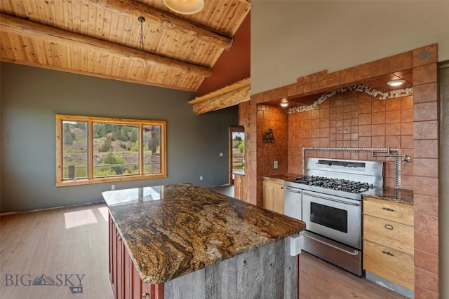1511 Mt Highway 287, Virginia City, MT 59755 - kitchen with stainless steel range with gas cooktop, wooden ceiling, light wood-style flooring, dark stone countertops, and a center island