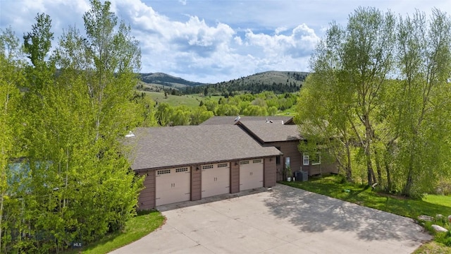1511 Mt Highway 287, Virginia City, MT 59755 - view of front of property with a mountain view, central AC, and a shingled roof