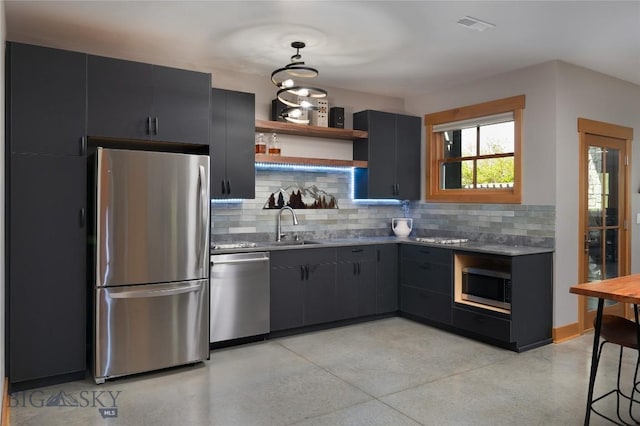 101 Columbine Ct, Bozeman, MT 59715 - kitchen featuring stainless steel appliances, decorative backsplash, dark cabinets, and open shelves