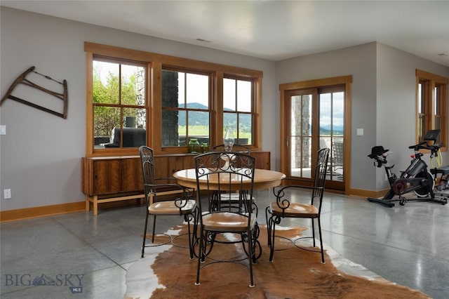 101 Columbine Ct, Bozeman, MT 59715 - dining area featuring concrete flooring, healthy amount of natural light, and baseboards