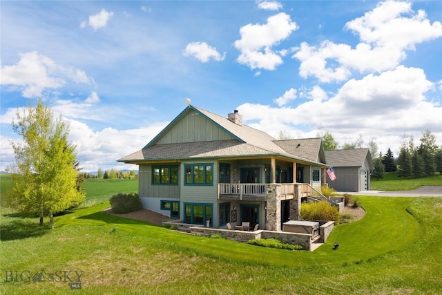101 Columbine Ct, Bozeman, MT 59715 - back of property featuring board and batten siding, a yard, concrete driveway, a chimney, and a garage
