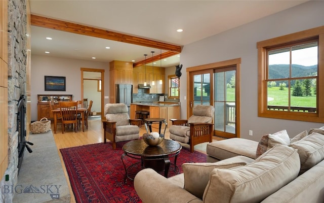 101 Columbine Ct, Bozeman, MT 59715 - living area featuring recessed lighting, a mountain view, beam ceiling, and light wood-style floors