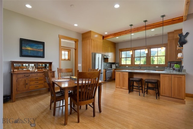 101 Columbine Ct, Bozeman, MT 59715 - dining room featuring recessed lighting, light wood-style floors, and beamed ceiling