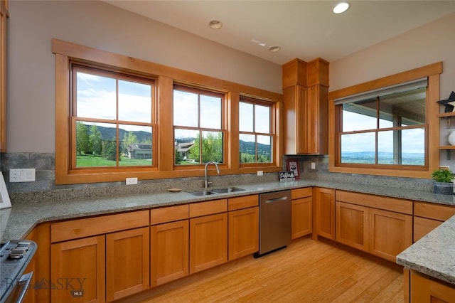 101 Columbine Ct, Bozeman, MT 59715 - kitchen with stainless steel dishwasher, a sink, light wood-style floors, plenty of natural light, and recessed lighting