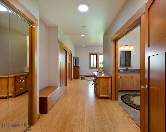 101 Columbine Ct, Bozeman, MT 59715 - hall featuring light wood finished floors, recessed lighting, a sink, and baseboards