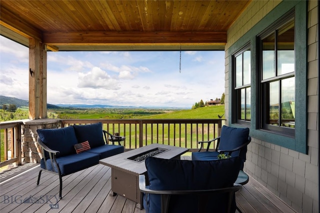 101 Columbine Ct, Bozeman, MT 59715 - wooden deck featuring an outdoor living space with a fire pit