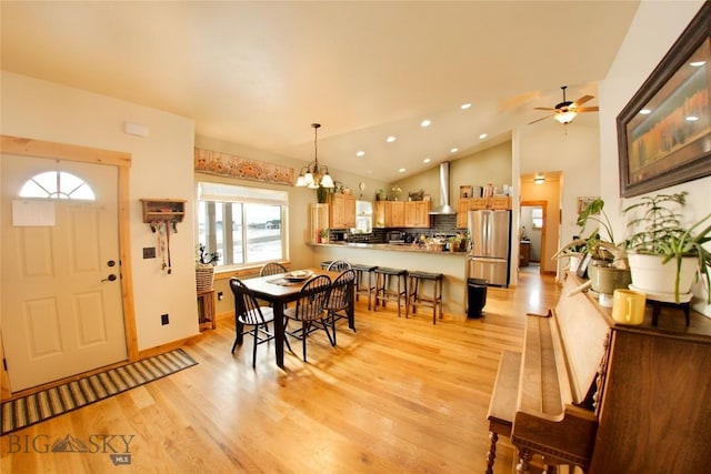 191 Rolling Prairie & Way, Three Forks, MT 59752 - dining space featuring light wood-style floors, a chandelier, recessed lighting, vaulted ceiling, and ceiling fan