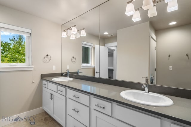 3123 Warbler Way Units A-D, Units A-D Bozeman, MT 59718 - bathroom featuring baseboards, double vanity, and recessed lighting