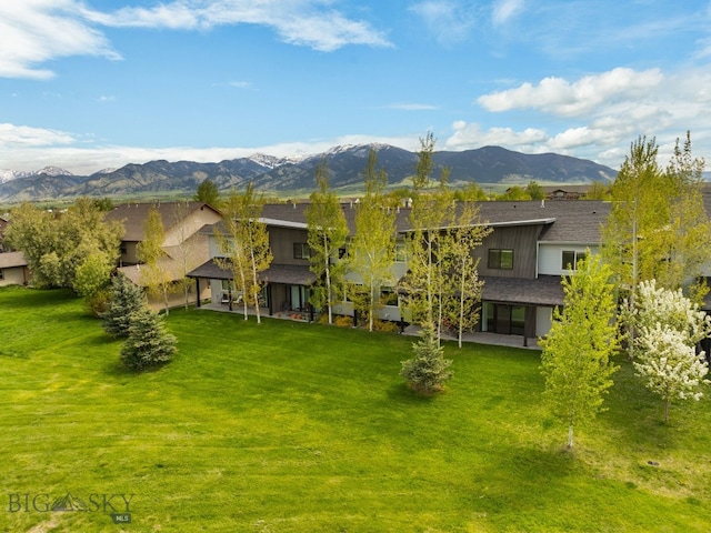 3123 Warbler Way Units A-D, Units A-D Bozeman, MT 59718 - back of property with a mountain view, a patio area, and a yard