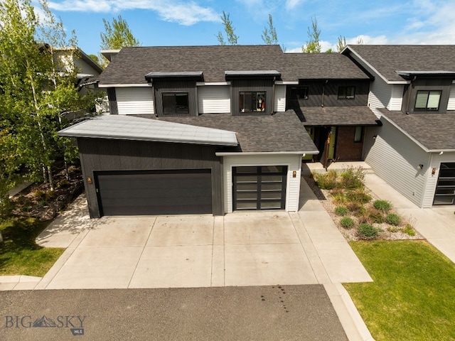 3123 Warbler Way Units A-D, Units A-D Bozeman, MT 59718 - view of front facade with an attached garage, driveway, and a shingled roof