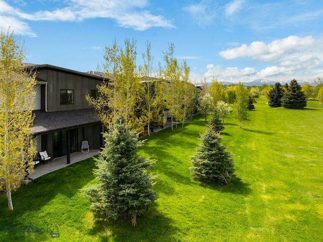 3123 Warbler Way Units A-D, Units A-D Bozeman, MT 59718 - view of green lawn with a patio area