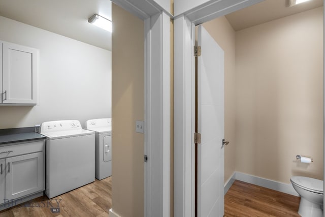 3123 Warbler Way Units A-D, Units A-D Bozeman, MT 59718 - washroom featuring washing machine and dryer, light wood finished floors, and baseboards
