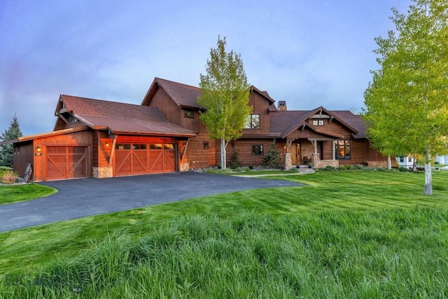 171 Brave Heart Loop, Bozeman, MT 59718 - view of front of property with stone siding and a front lawn