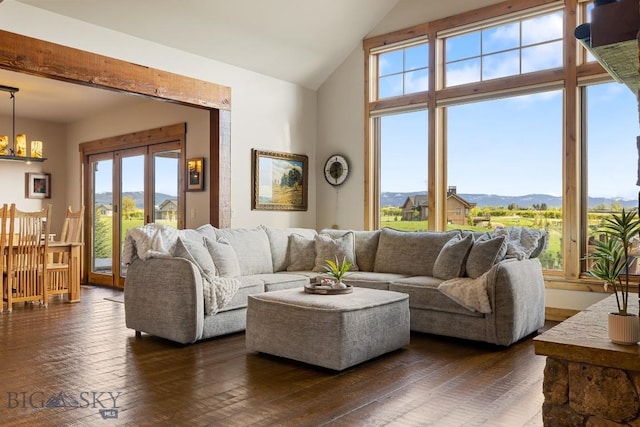 171 Brave Heart Loop, Bozeman, MT 59718 - living area featuring plenty of natural light, a mountain view, a chandelier, dark wood-style flooring, and high vaulted ceiling