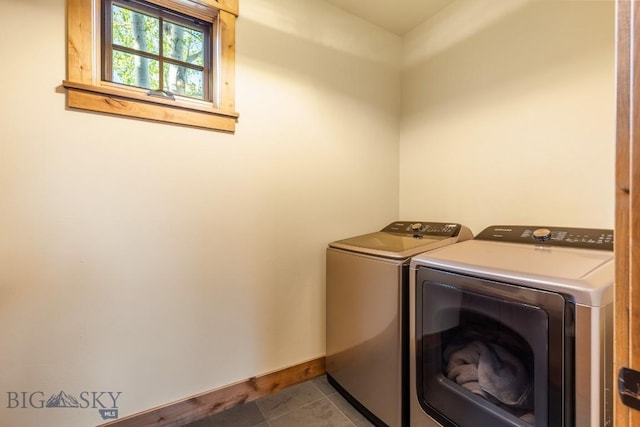 171 Brave Heart Loop, Bozeman, MT 59718 - washroom with separate washer and dryer, baseboards, and tile patterned floors