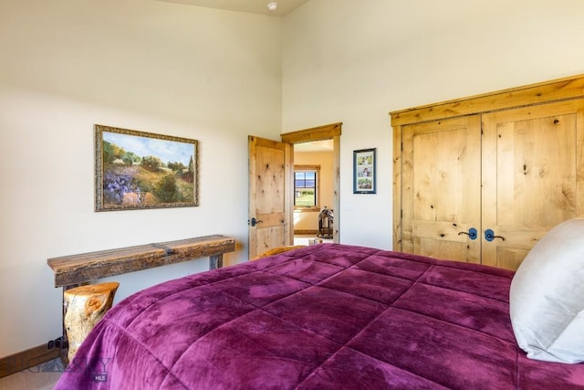 171 Brave Heart Loop, Bozeman, MT 59718 - bedroom featuring a towering ceiling and baseboards