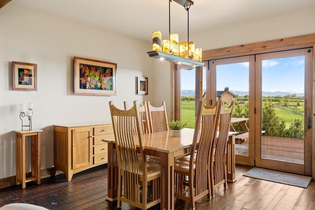171 Brave Heart Loop, Bozeman, MT 59718 - dining space with dark wood-type flooring, a chandelier, and a mountain view