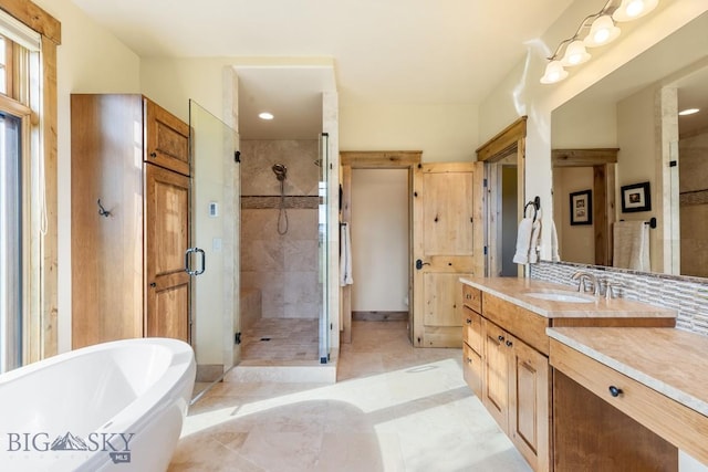 171 Brave Heart Loop, Bozeman, MT 59718 - bathroom featuring a shower stall, a freestanding tub, vanity, and recessed lighting