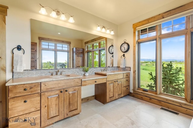 171 Brave Heart Loop, Bozeman, MT 59718 - bathroom with vanity and decorative backsplash