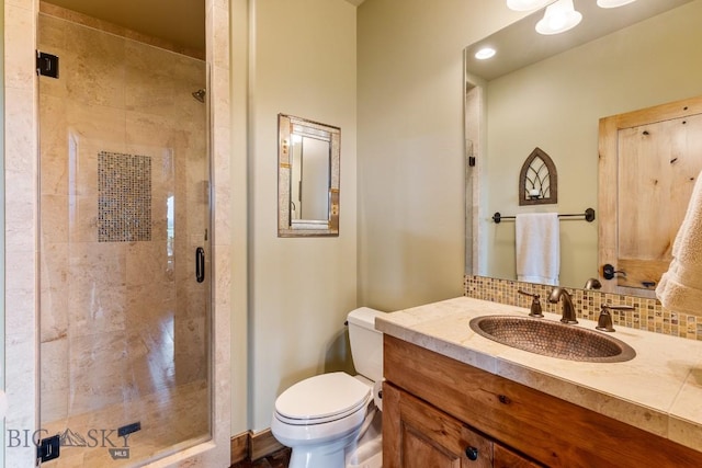 171 Brave Heart Loop, Bozeman, MT 59718 - full bath featuring a stall shower, toilet, vanity, and tasteful backsplash