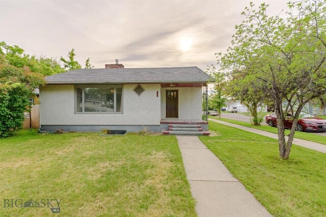 602 1st Ave E, Three Forks, MT 59752 - view of front of property featuring a chimney and stucco siding