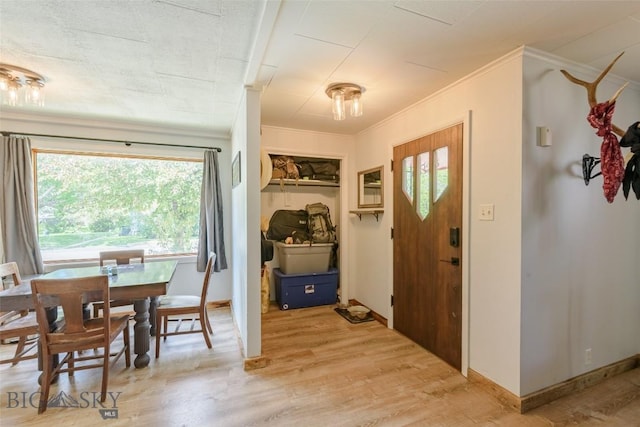 602 1st Ave E, Three Forks, MT 59752 - foyer entrance featuring light wood-type flooring and crown molding