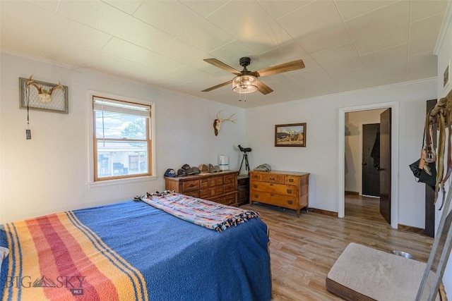 602 1st Ave E, Three Forks, MT 59752 - bedroom with light wood-style flooring, ornamental molding, a ceiling fan, and baseboards