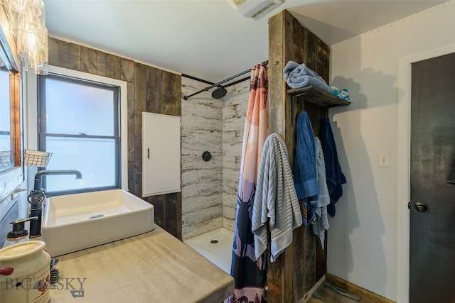 602 1st Ave E, Three Forks, MT 59752 - bathroom featuring a sink and a tile shower
